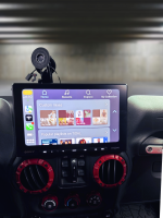 Sony multimedia display screen in a Jeep JK showing music playlists and options.