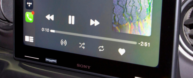 Sony car infotainment system showing music playback interface with album art and controls.
