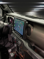 Angled view of the 2018-2023 Jeep Wrangler JL dashboard featuring the Sony XAV-AX8500 multimedia receiver installed using the Prolific Audio DIY installation kit.