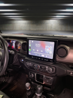 Dashboard view of a 2018-2023 Jeep Wrangler JL showcasing the Sony XAV-AX8500 multimedia receiver installed using the Prolific Audio DIY installation kit.