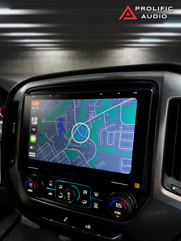 Sony XAV-9500ES multimedia receiver installed in a 2014-2019 Chevrolet Silverado or GMC Sierra, showing a map navigation screen with clear road details.