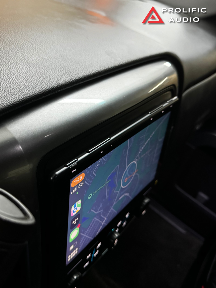 Side view of the Sony XAV-9500ES multimedia receiver installed in a 2014-2019 Chevrolet Silverado or GMC Sierra, showcasing seamless dash integration.