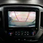 Chevrolet Silverado dash shows a Sony 10.1-inch touchscreen with rear-view camera guidance and yellow parking lines.