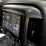 Black 10.1-inch touchscreen showing media on the Sony XAV9500ES radio in a Chevrolet Silverado dash with clean trim and controls.