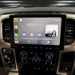 Car stereo display showing music playback of Kendrick Lamar's song 'Squabble Up' with artist details and controls.