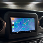 Sony car navigation system display showing a detailed map interface with location markers and route options for drivers.