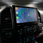 Car dashboard featuring a Sony display showing a navigation map and vehicle controls.