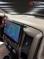 Car dashboard with a mounted touchscreen display showing a navigation map and control buttons.