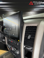 Sony car stereo display mounted in a vehicle, showing a music playback interface with album artwork.