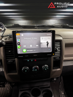 Car stereo system displaying music playback interface with album cover and song details.