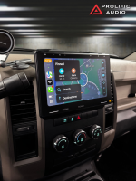 Sony car stereo system with a large touchscreen displaying navigation and destination options in a vehicle interior.