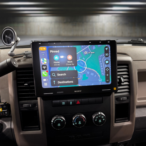 Sony car stereo display showing navigation interface with map and search options in a vehicle interior.