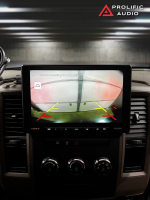 Sony car stereo display showing a rearview camera view with guidelines for parking assistance.