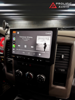 Car stereo display showing the song 'Tennessee Whiskey' by Chris Stapleton with album cover on screen.