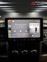 Car stereo display showing the song 'Tennessee Whiskey' by Chris Stapleton with album cover on screen.