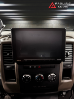 Sony car stereo display installed in a vehicle dashboard with control knobs and buttons.