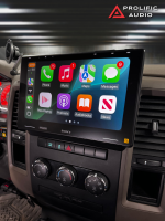 Sony car stereo display with Apple CarPlay interface showing various apps including Phone, Music, and Maps.