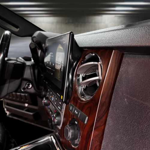Interior view of a car dashboard featuring a touchscreen display and wooden accents from Prolific Audio.