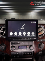 Sony car stereo display showing time and various audio options in a vehicle dashboard.