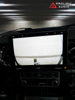 Sony car stereo display showing a rearview camera feed in a vehicle interior.